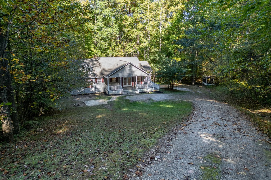 7 Spring Road Blairsville, GA 30512 - Photo 43 of 56 a view of a house with a yard tree and sitting area