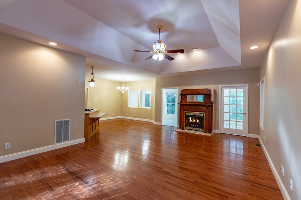7 Spring Road Blairsville, GA 30512 - Photo 5 of 56 a view of an empty room with window and wooden floor