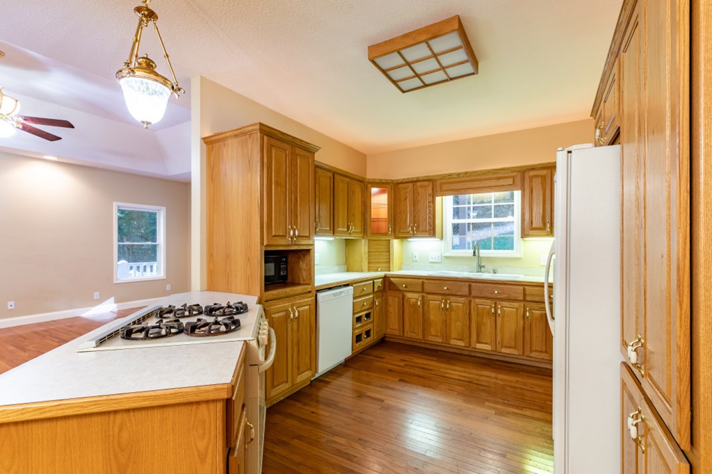 7 Spring Road Blairsville, GA 30512 - Photo 9 of 56 a kitchen with a stove a refrigerator and a stove