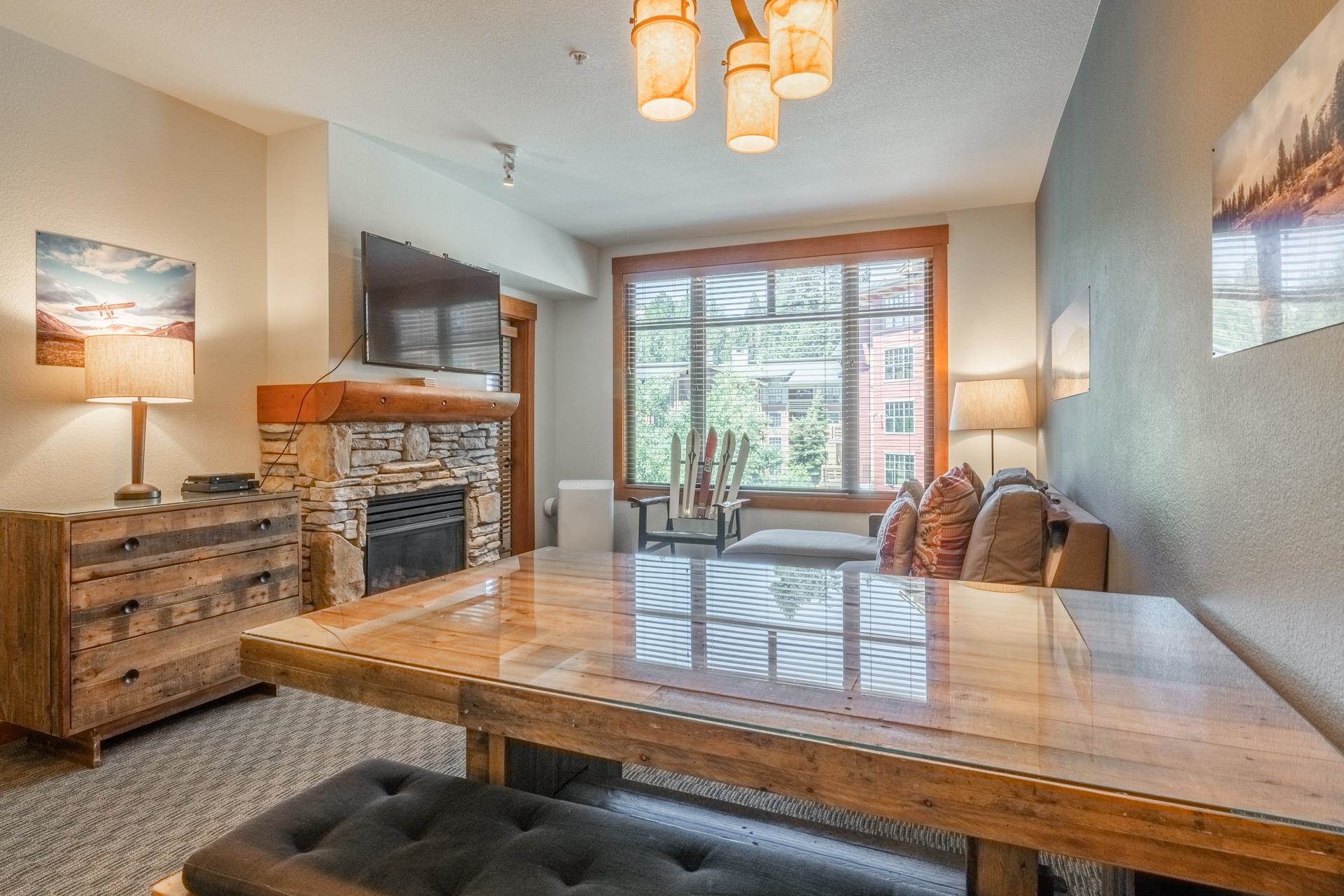 6201 Minaret Road, Unit 2312 Mammoth Lakes, CA 93546 - Photo 8 of 41 a kitchen with a stove a sink and a microwave