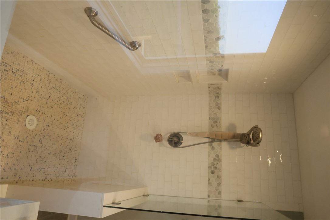 5381 Olden Porter Road Pendleton, SC 29670 - Photo 16 of 31 This spacious shower features pristine tile work and a convenient grab bar for comfort.