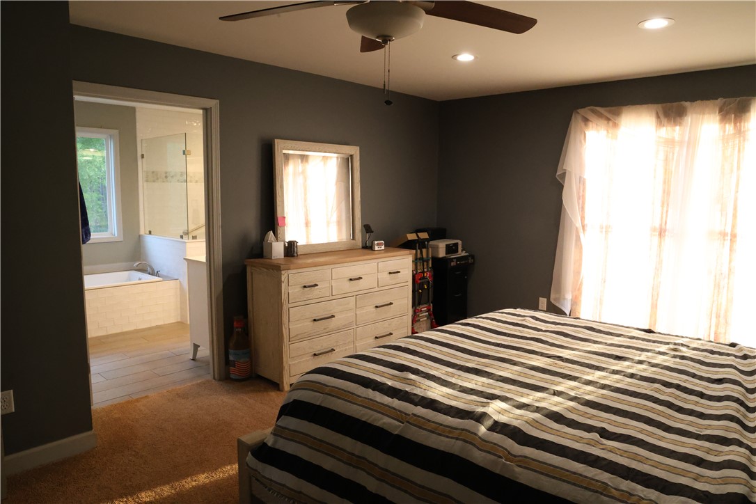 5381 Olden Porter Road Pendleton, SC 29670 - Photo 20 of 31 This tranquil bedroom offers comfort and a private attached bathroom.