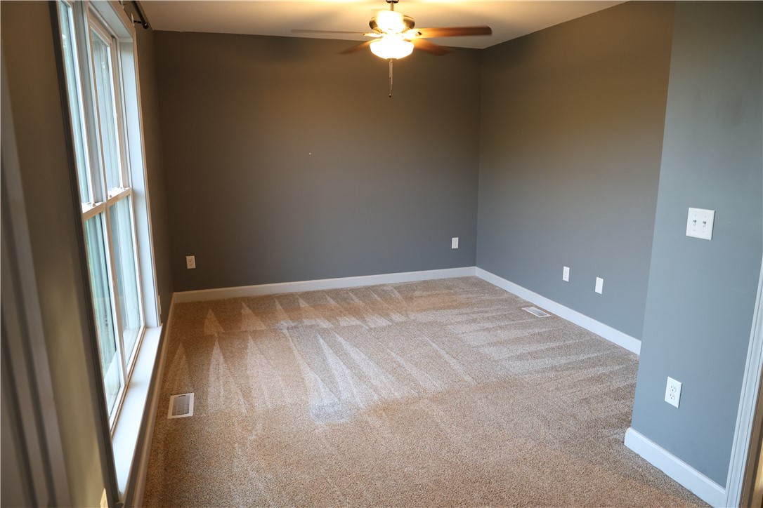 5381 Olden Porter Road Pendleton, SC 29670 - Photo 24 of 31 Bright and airy bedroom with neutral carpeting and ample natural light awaits your personal touch.