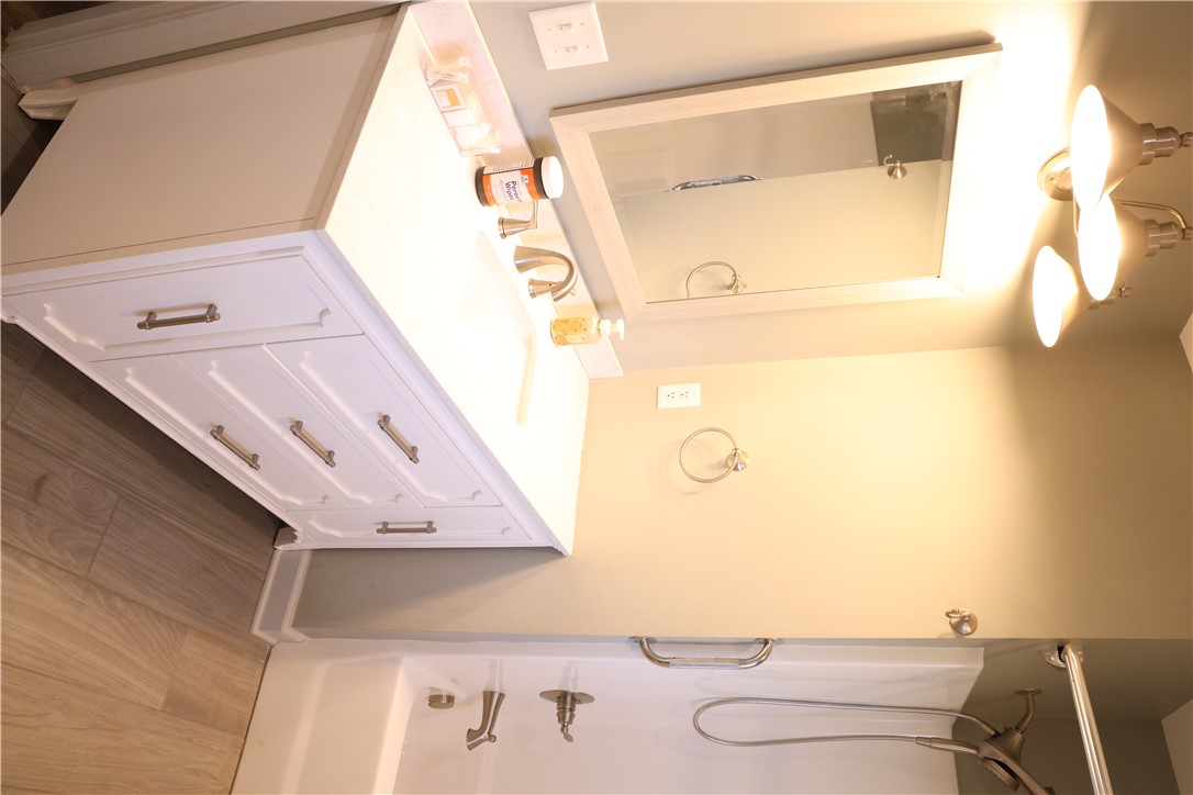 5381 Olden Porter Road Pendleton, SC 29670 - Photo 26 of 31 This bright bathroom features a vanity with ample storage and a combination shower and tub.