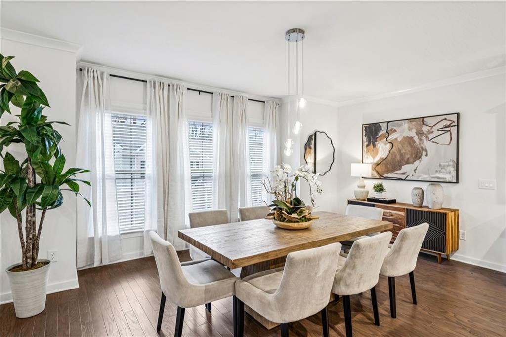 1155 Millennium Park Road Decatur, GA 30033 - Photo 16 of 81 a view of a dining room with furniture window and wooden floor