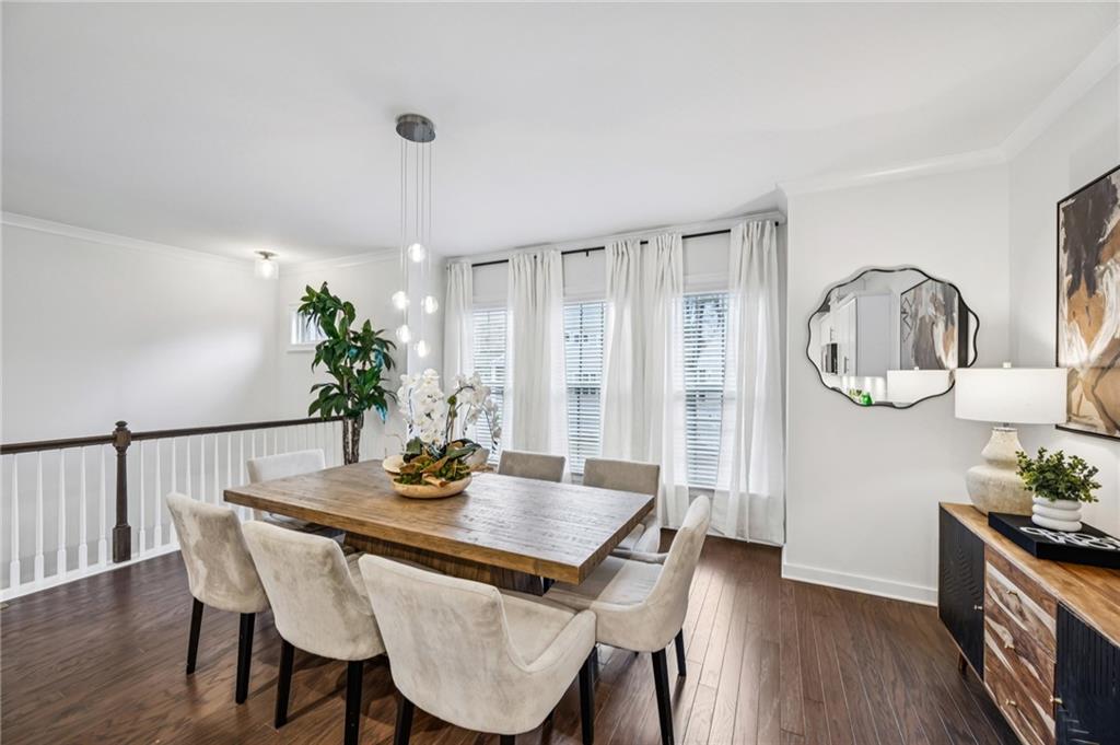 1155 Millennium Park Road Decatur, GA 30033 - Photo 17 of 81 a view of a dining room with furniture and wooden floor
