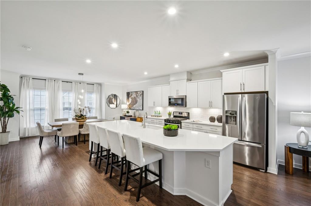 1155 Millennium Park Road Decatur, GA 30033 - Photo 20 of 81 a kitchen with appliances a table and chairs in it