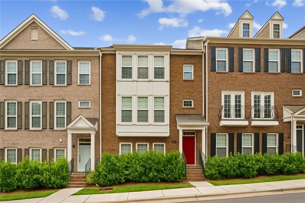 1155 Millennium Park Road Decatur, GA 30033 - Photo 2 of 81 a front view of a residential apartment building with a yard