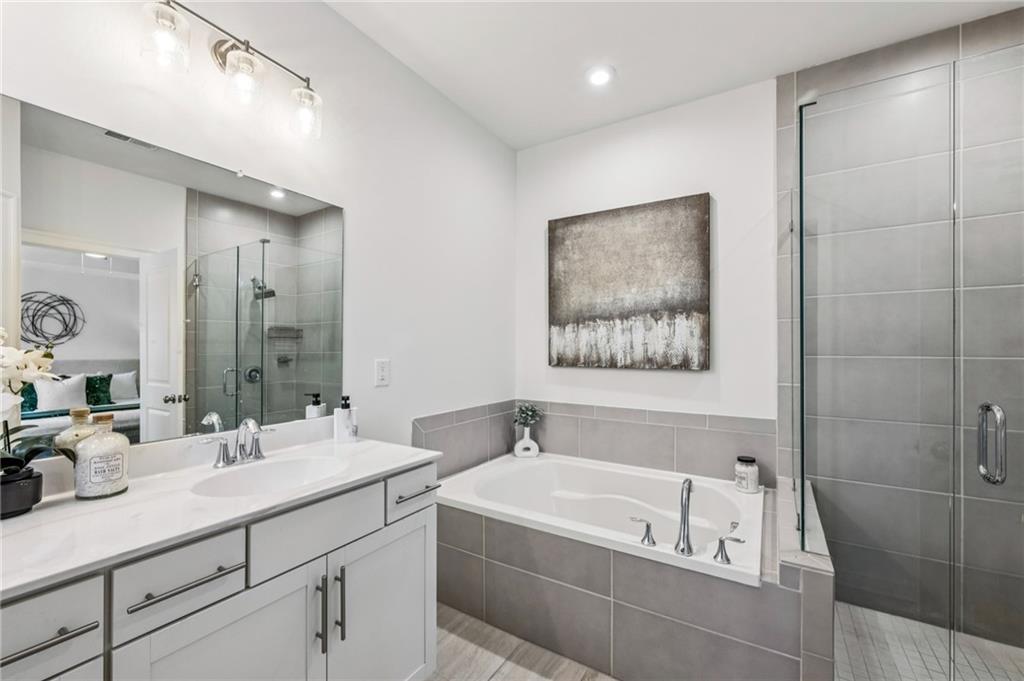 1155 Millennium Park Road Decatur, GA 30033 - Photo 40 of 81 a bathroom with a tub a sink and mirror