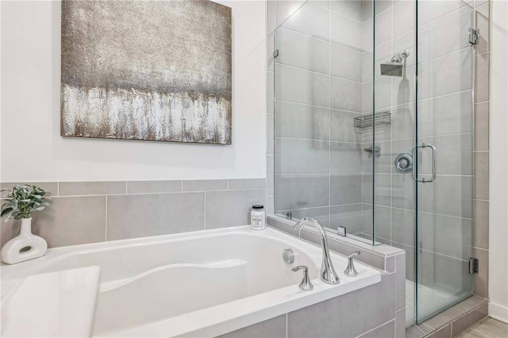 1155 Millennium Park Road Decatur, GA 30033 - Photo 41 of 81 a white bath tub sitting next to a white sink and vanity