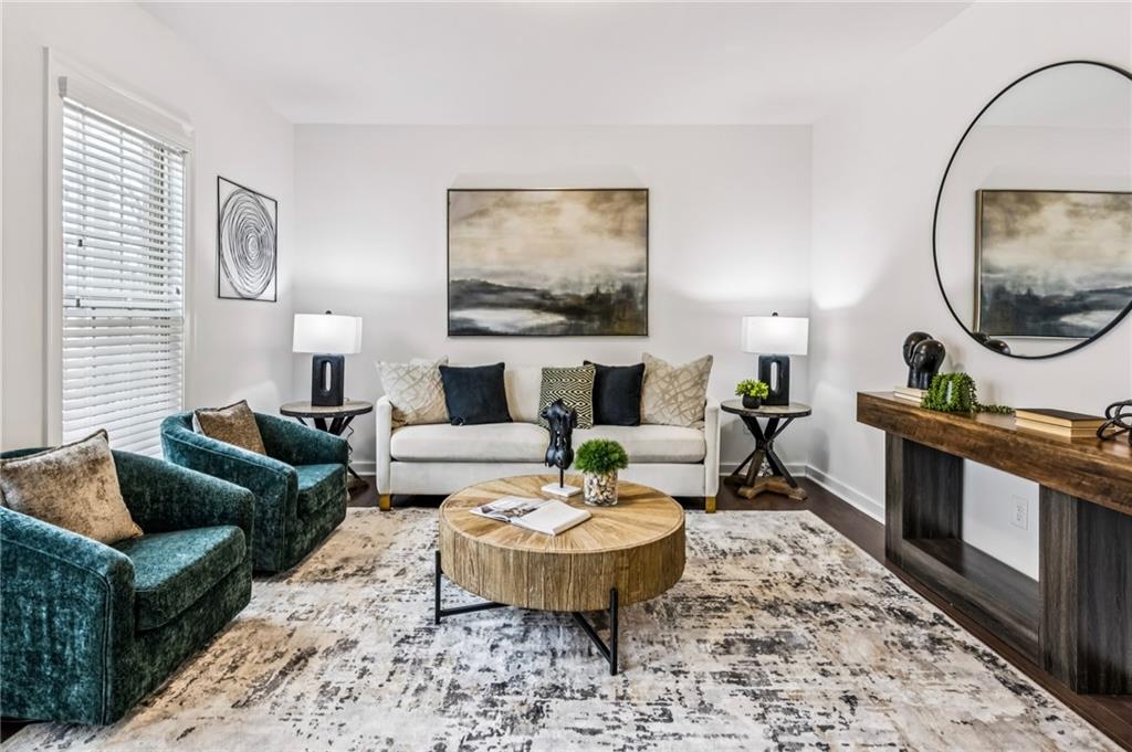 1155 Millennium Park Road Decatur, GA 30033 - Photo 51 of 81 a living room with furniture a rug and a mirror