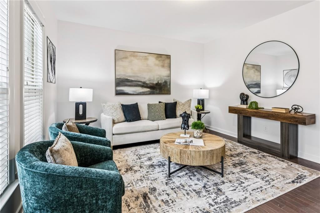 1155 Millennium Park Road Decatur, GA 30033 - Photo 52 of 81 a living room with furniture a rug and a mirror