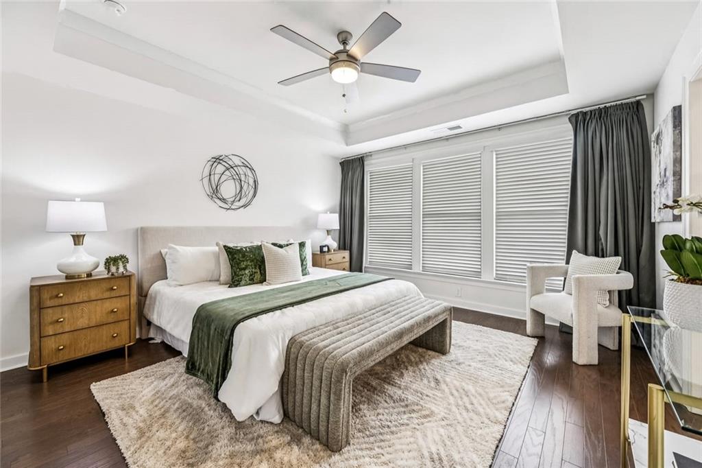 1155 Millennium Park Road Decatur, GA 30033 - Photo 7 of 81 a bedroom with a bed and a table with a chandelier