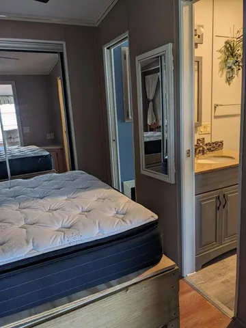 a bedroom with a bed and a dresser