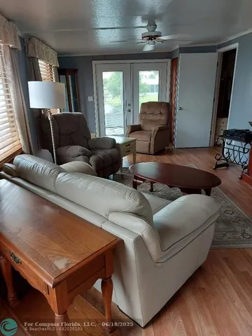 a kitchen with stainless steel appliances granite countertop a stove a microwave and a refrigerator