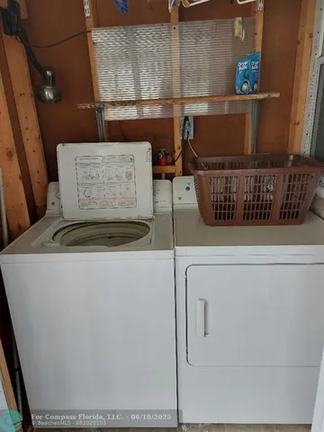 a view of a dining room with furniture and window