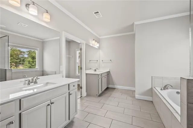 a bathroom with a sink a toilet and vanity