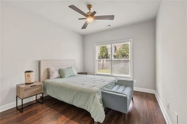 a bedroom with a bed and a chair