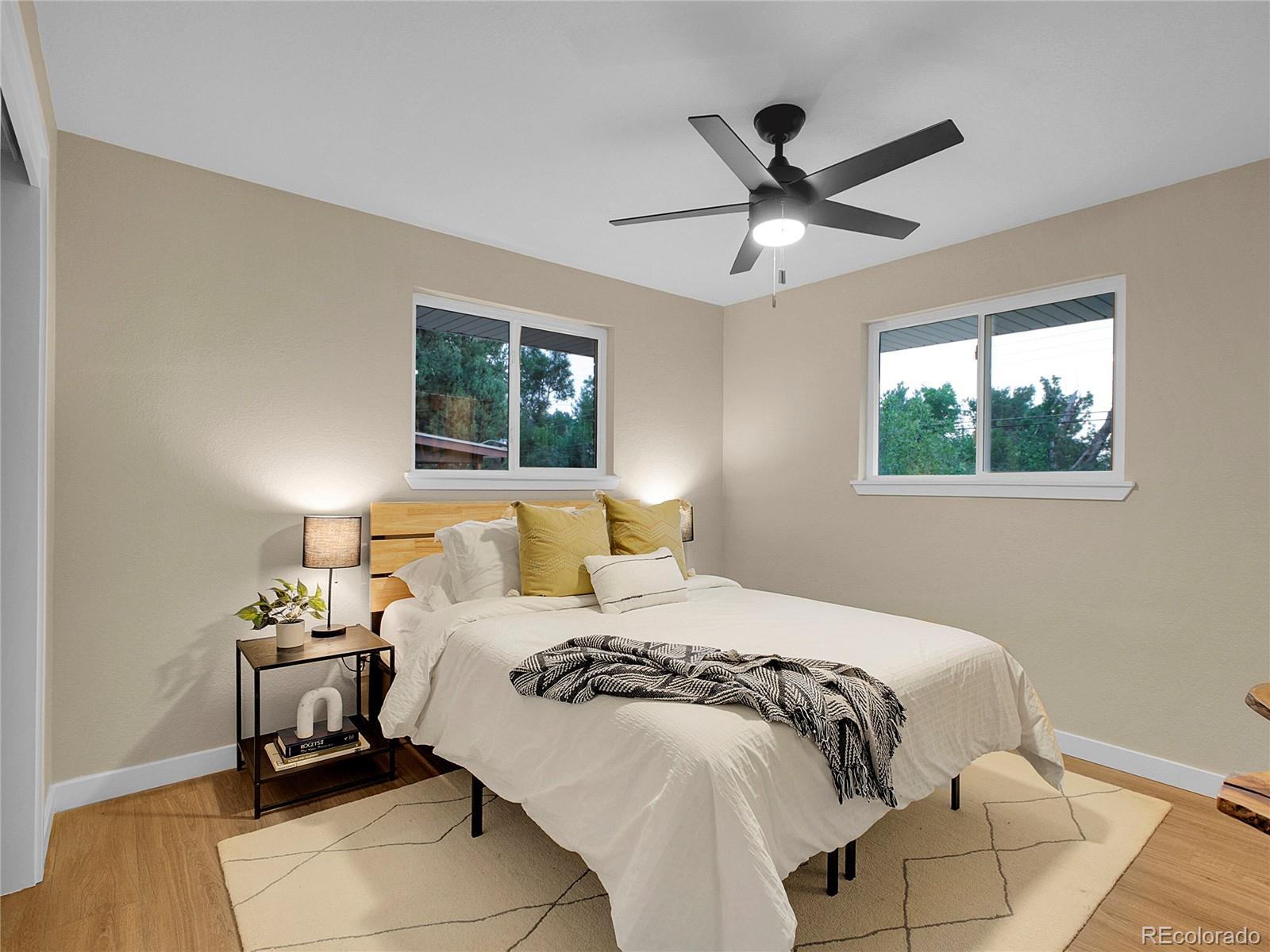 215 East Panama Drive Centennial, CO 80121 - Photo 11 of 50 a bedroom with a bed and window