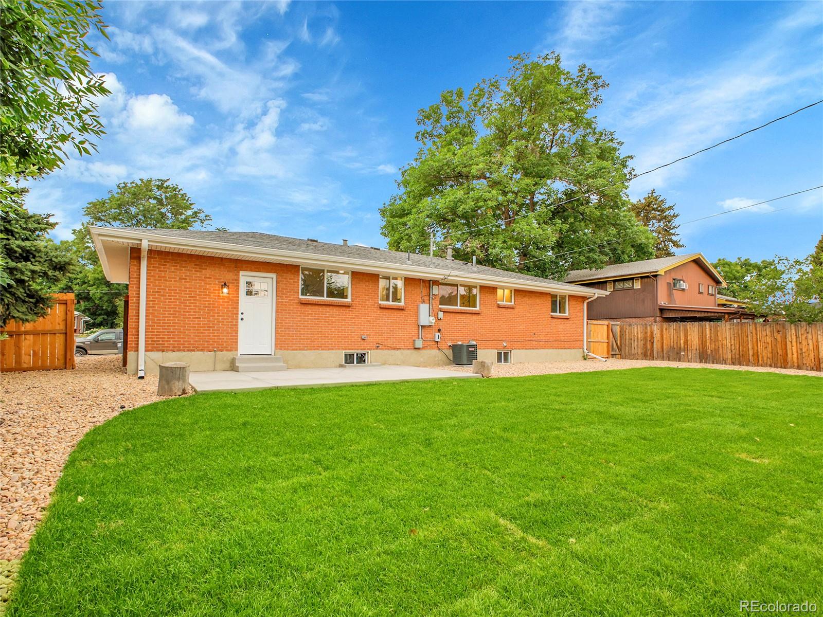 215 East Panama Drive Centennial, CO 80121 - Photo 14 of 50 a front view of house with yard and outdoor seating