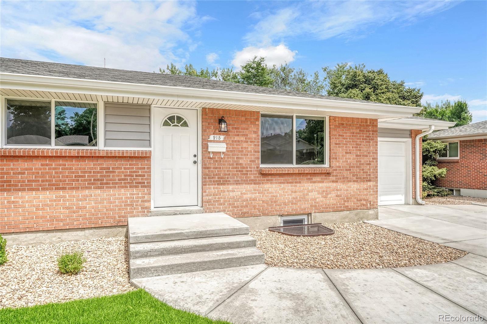 215 East Panama Drive Centennial, CO 80121 - Photo 19 of 50 a front view of a house with a yard
