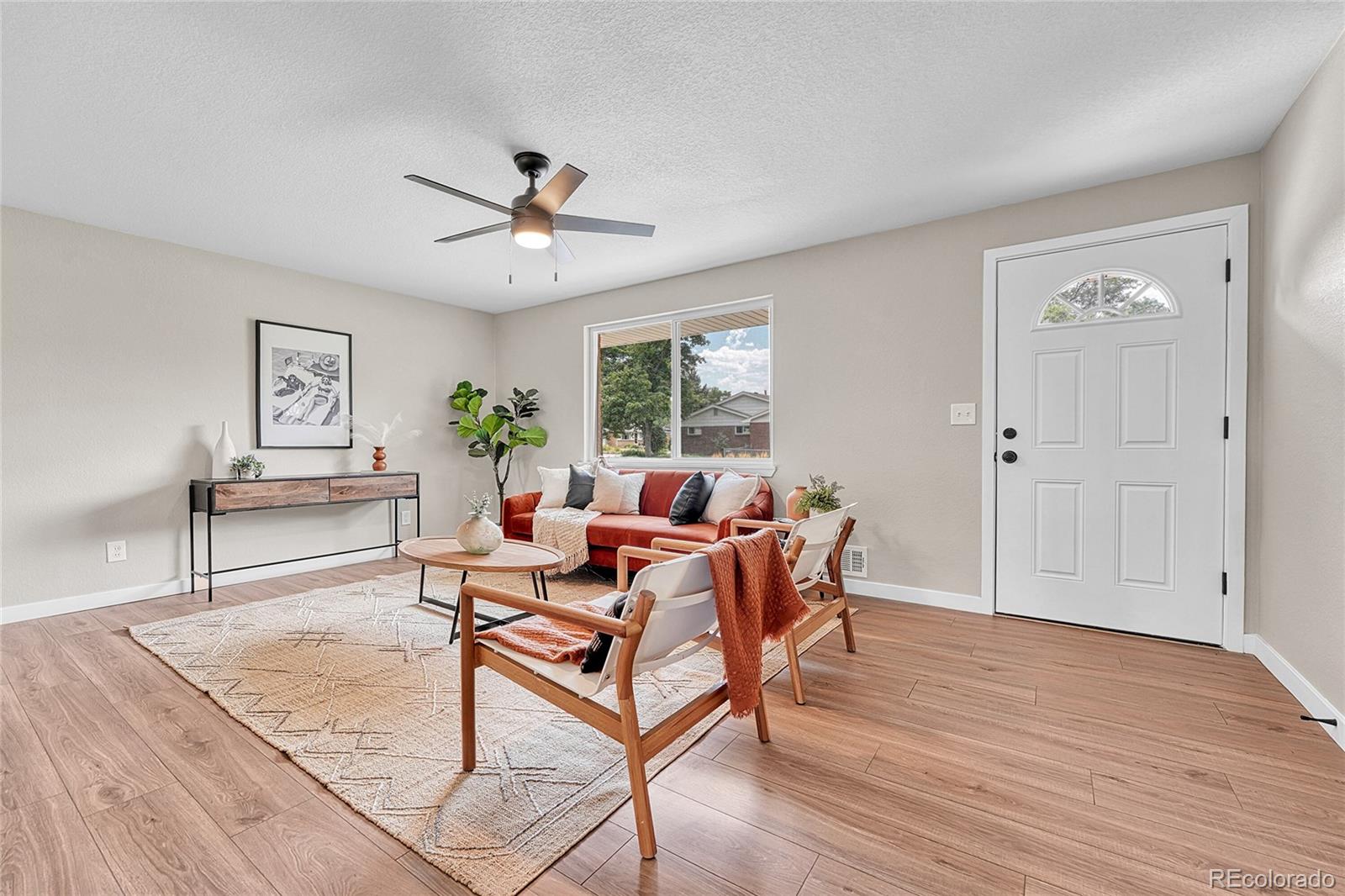215 East Panama Drive Centennial, CO 80121 - Photo 21 of 50 a dining room with furniture a chandelier and wooden floor