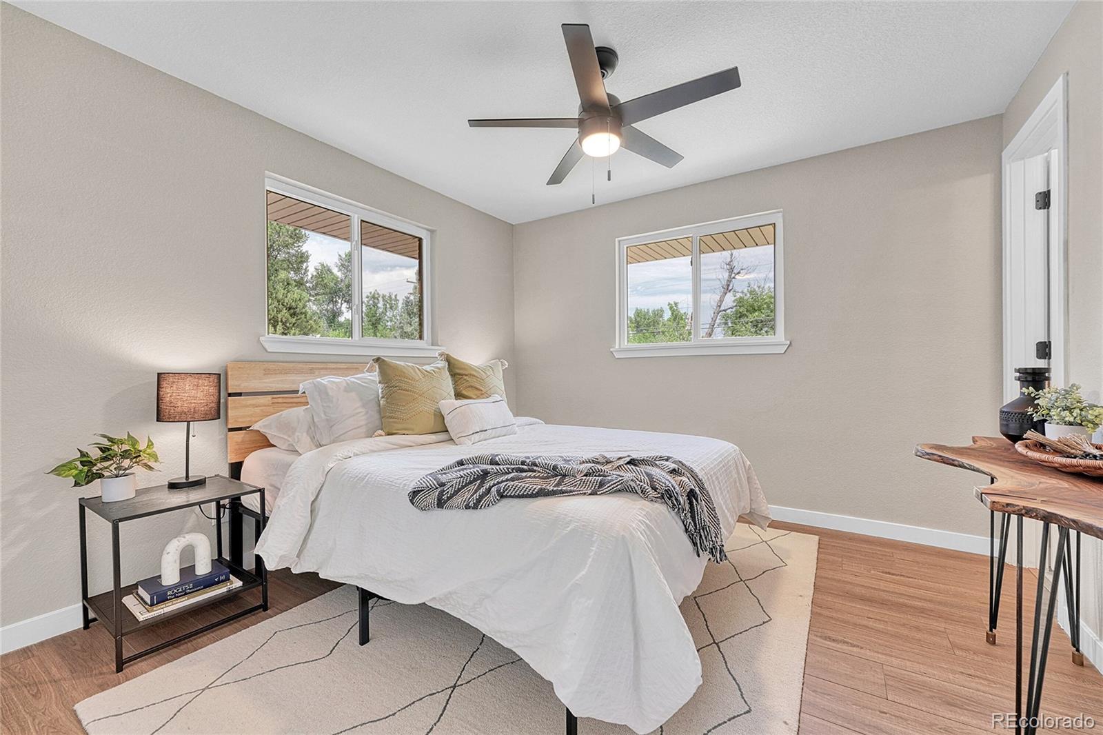 215 East Panama Drive Centennial, CO 80121 - Photo 32 of 50 a bedroom with bed and a window