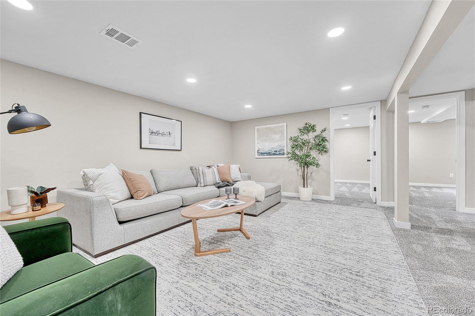 215 East Panama Drive Centennial, CO 80121 - Photo 35 of 50 a living room with furniture and a potted plant