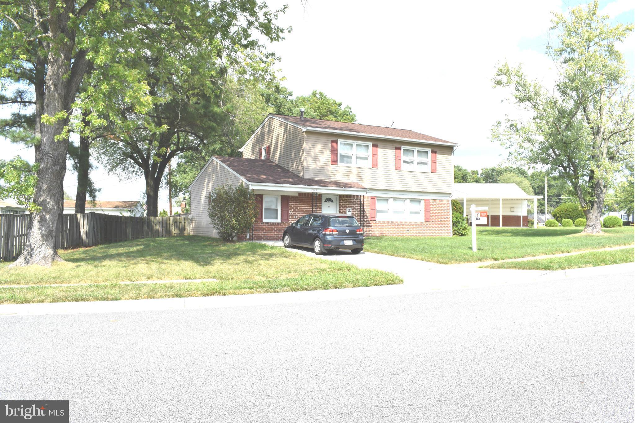 1902 Brookdale Road Windsor Mill, MD 21244 - Photo 1 of 13 a view of a house with a yard and large tree
