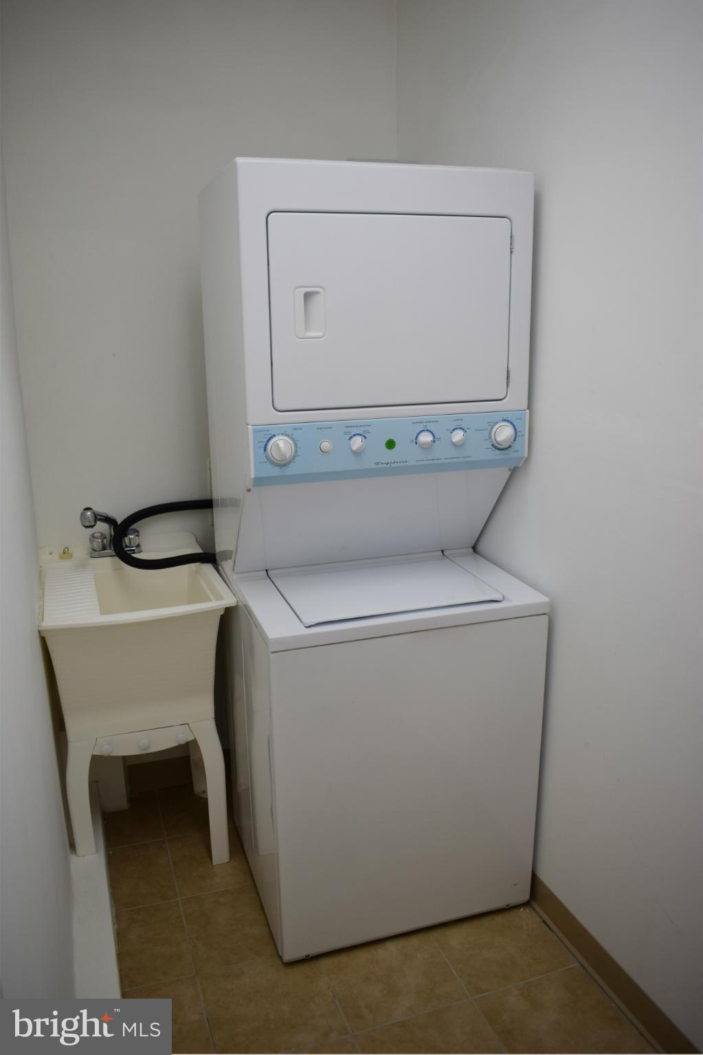 1902 Brookdale Road Windsor Mill, MD 21244 - Photo 6 of 13 a utility room with dryer and washer