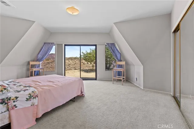 a view of a kitchen with furniture and a window