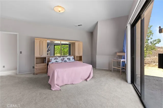 a view of a kitchen with furniture and windows