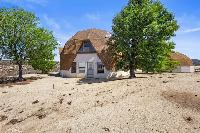 an aerial view of a house having yard