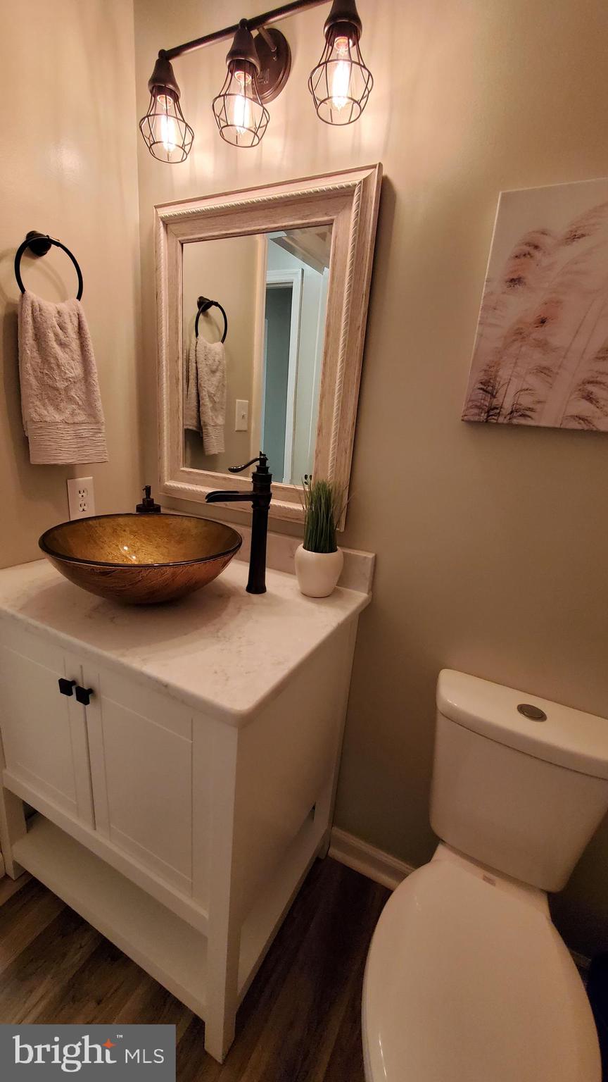 916 Timber Lane Reading, PA 19608 - Photo 16 of 29 a bathroom with a toilet sink and mirror