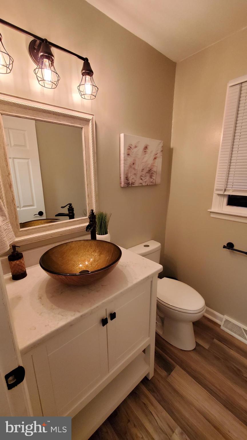 916 Timber Lane Reading, PA 19608 - Photo 17 of 29 a bathroom with a sink toilet and mirror