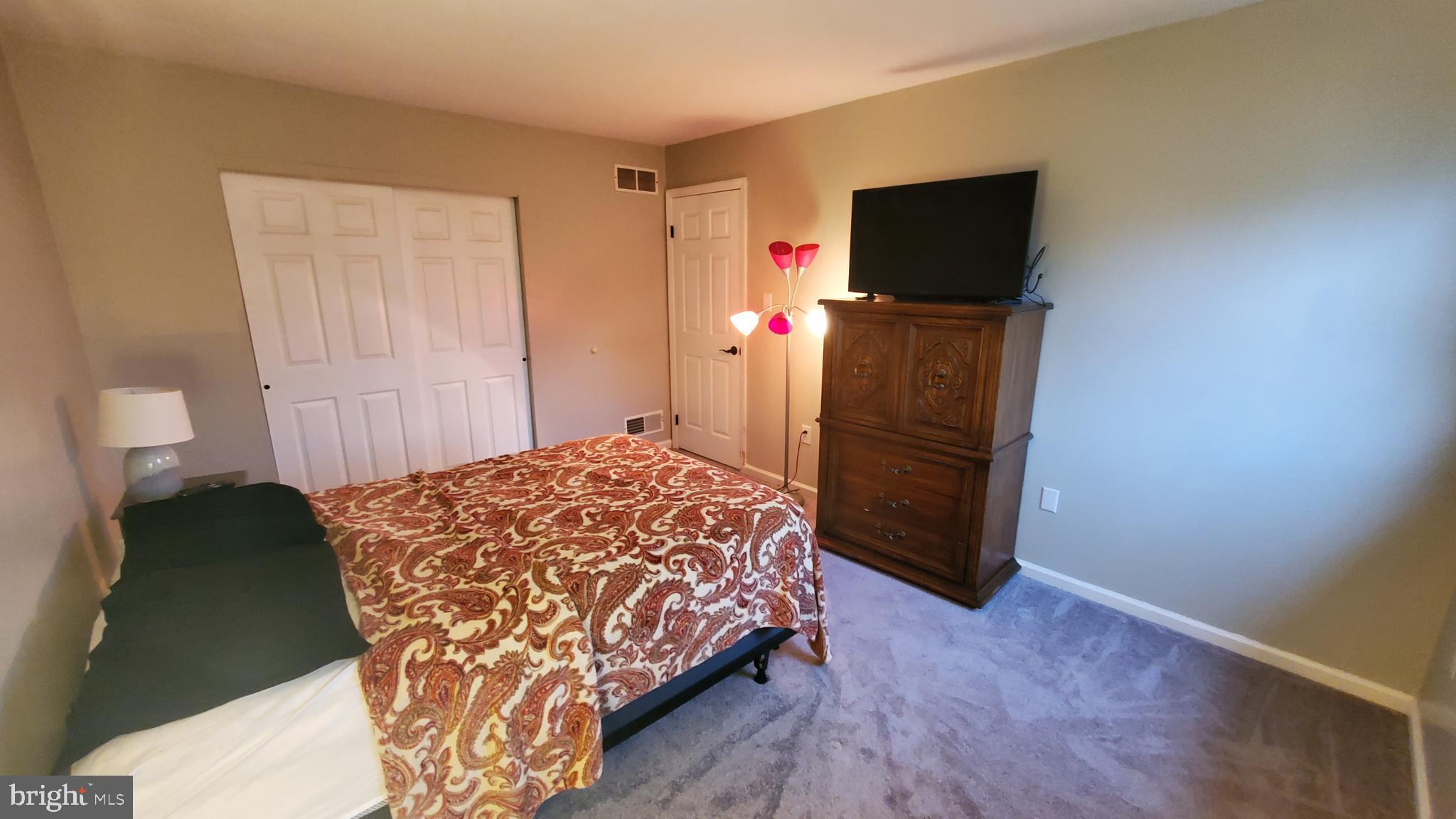 916 Timber Lane Reading, PA 19608 - Photo 24 of 29 a bedroom with a bed and flat screen tv
