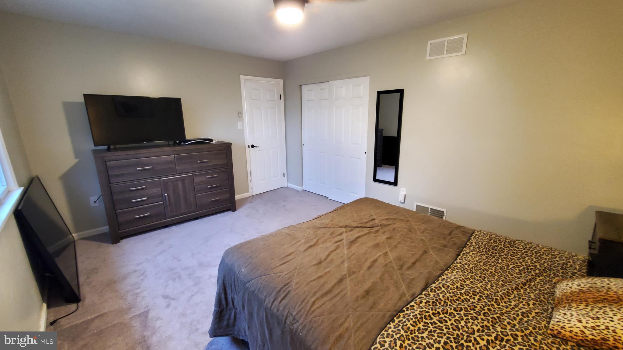 916 Timber Lane Reading, PA 19608 - Photo 27 of 29 a bedroom with a bed and flat screen tv