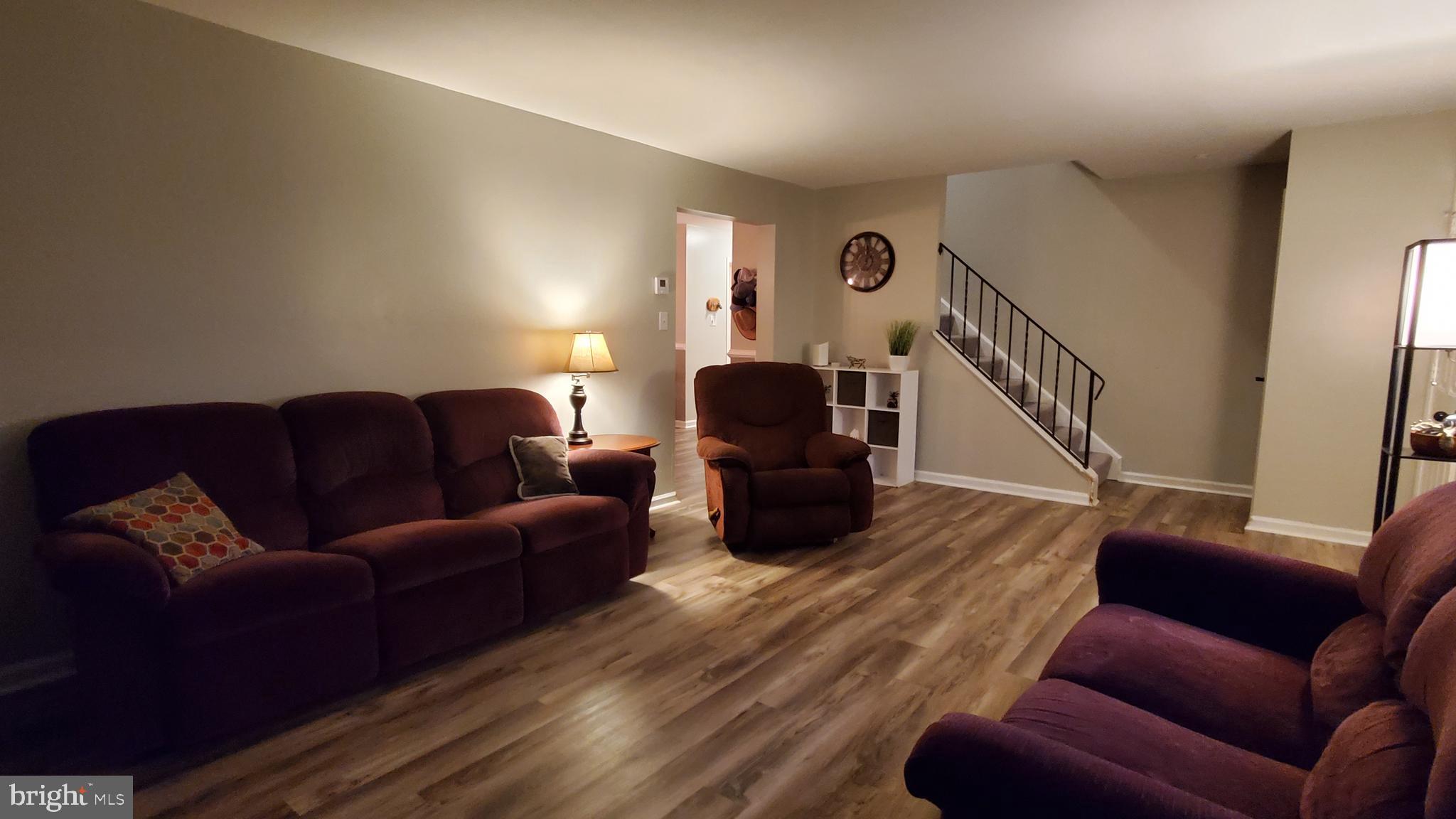 916 Timber Lane Reading, PA 19608 - Photo 3 of 29 a living room with furniture or stairs and a couch