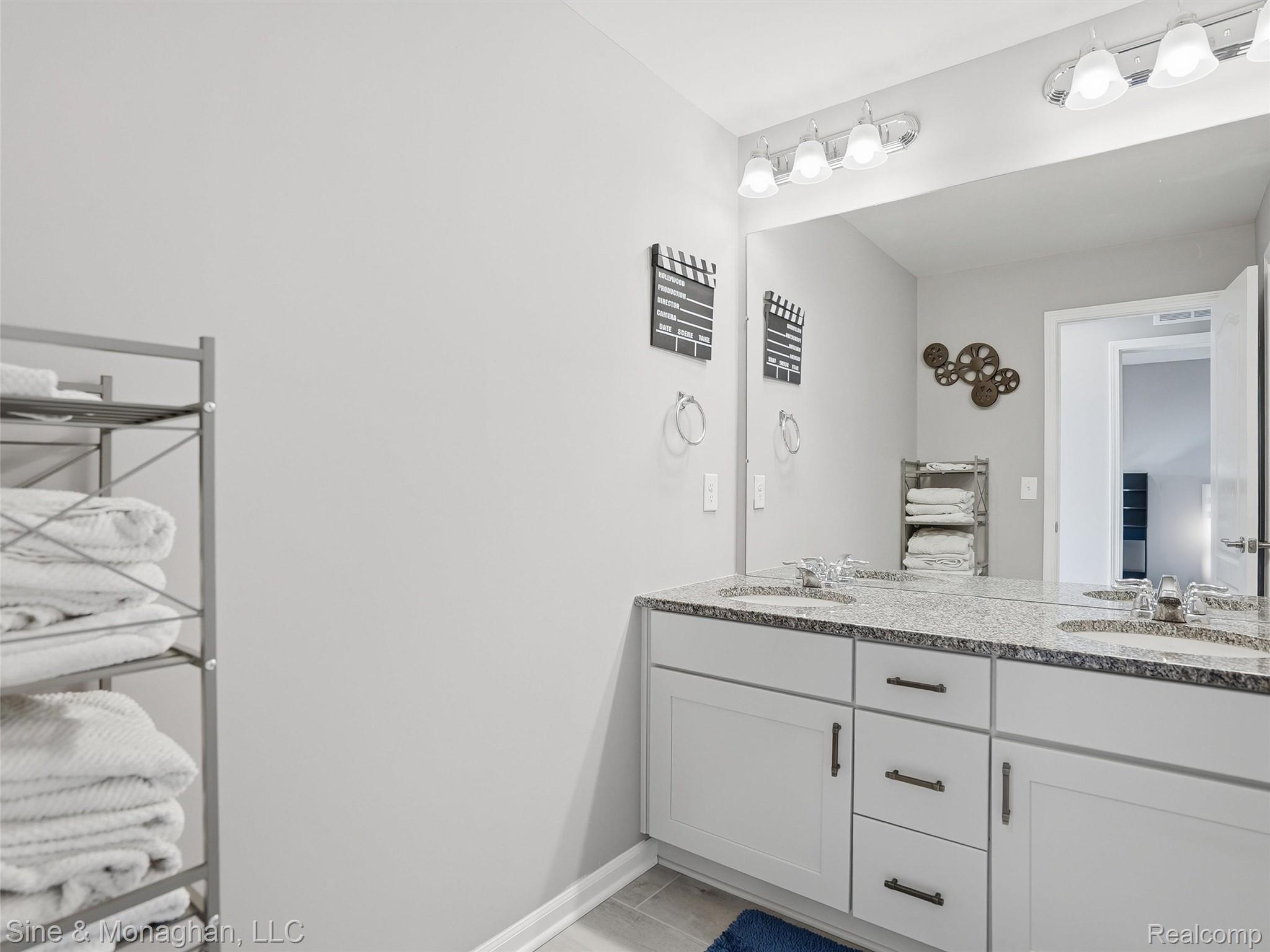 24827 Ivy Road Novi, MI 48375 - Photo 23 of 38 Dual vanity with stone-finish countertop, undermount sinks, and chrome faucets