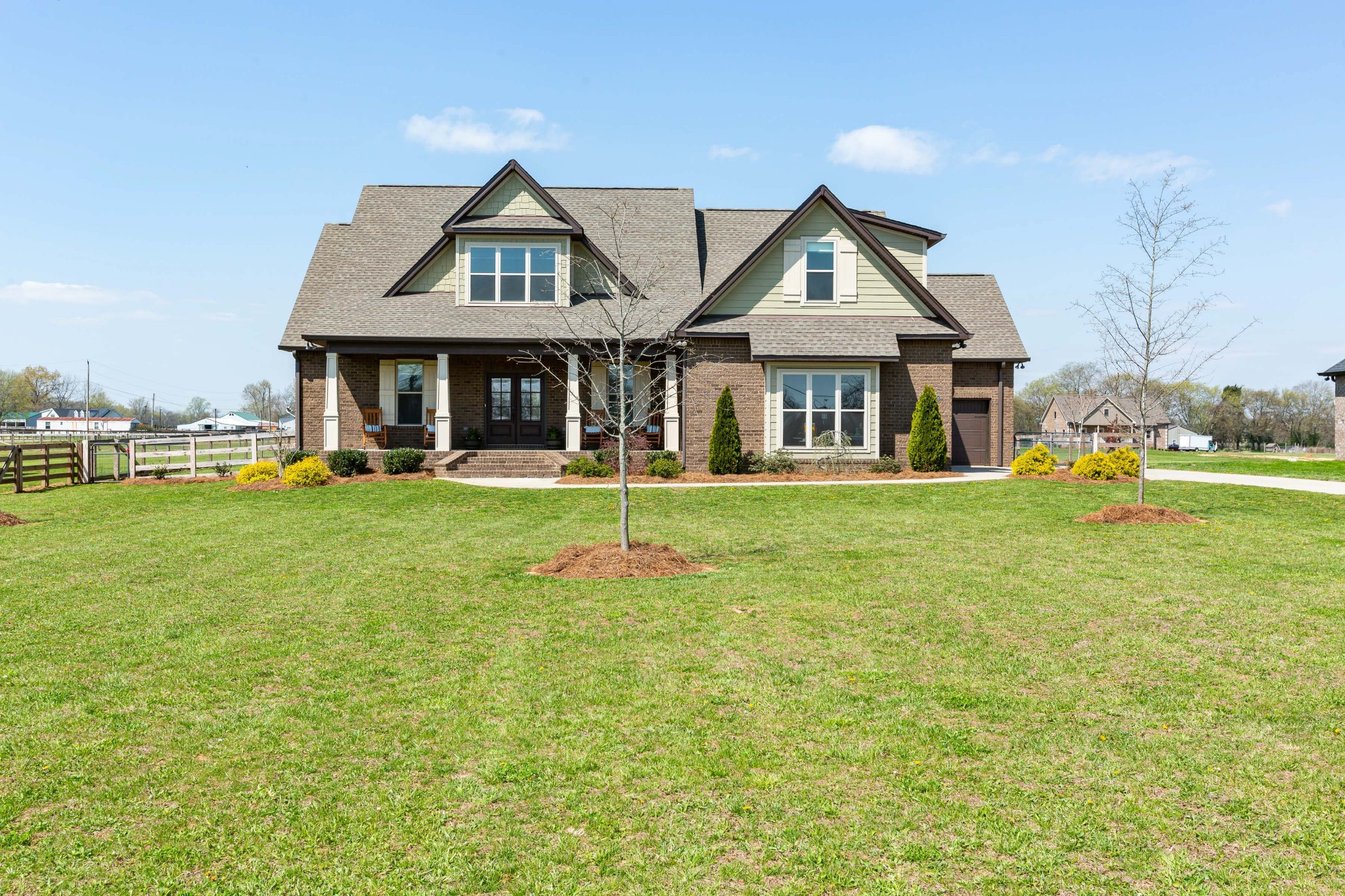 a front view of a house with a yard