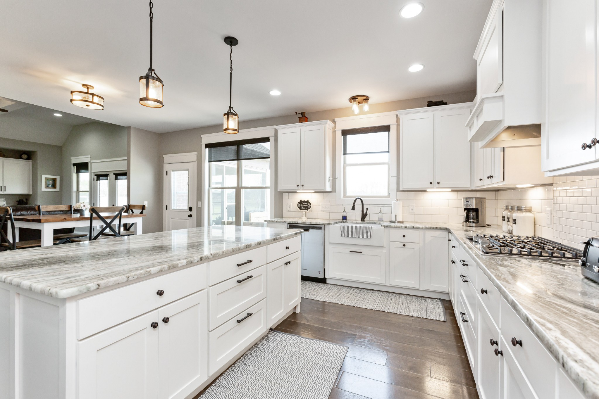 459 Halltown Road Portland, TN 37148 - Photo 10 of 42 a kitchen with granite countertop kitchen island white cabinets and white appliances