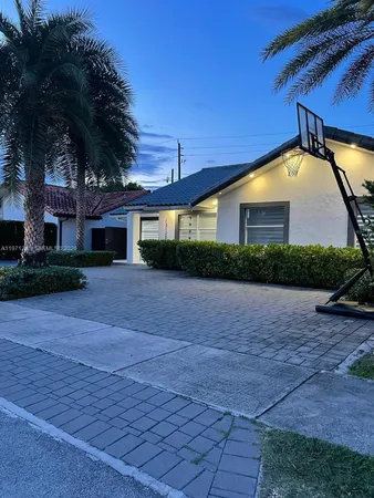 a front view of house with yard and green space