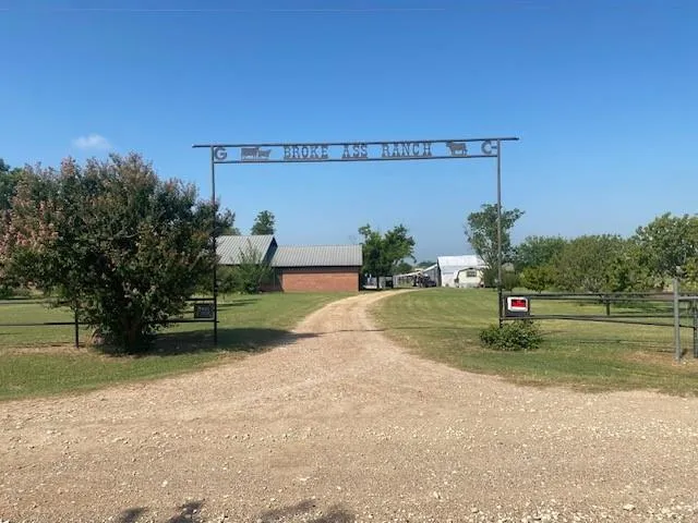 a front view of a house with a yard table and chairs