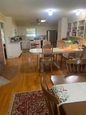 a spacious bedroom with a bed and a window