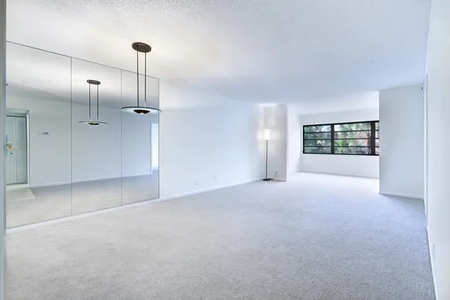 a view of empty room with windows