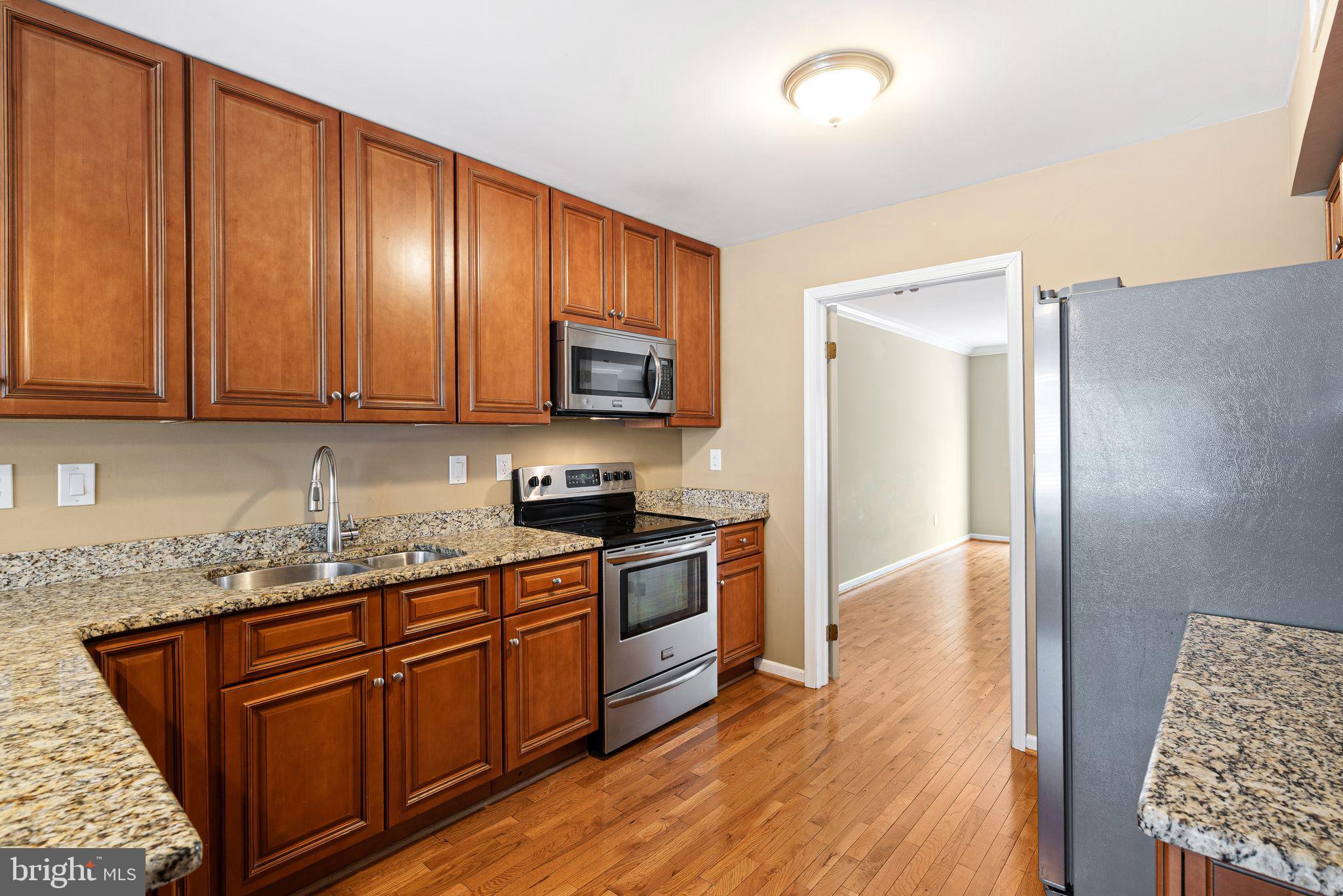 503 Brighton Road, Unit 5C Devon, PA 19333 - Photo 3 of 34 Kitchen w/Stainless Steel Appliances and Granite
