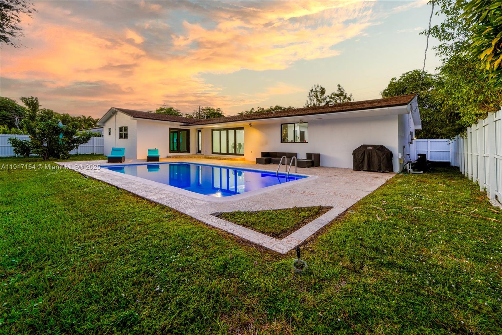 1850 Northeast 199th Street Miami, FL 33179 - Photo 1 of 29 a view of a house with pool yard and a yard