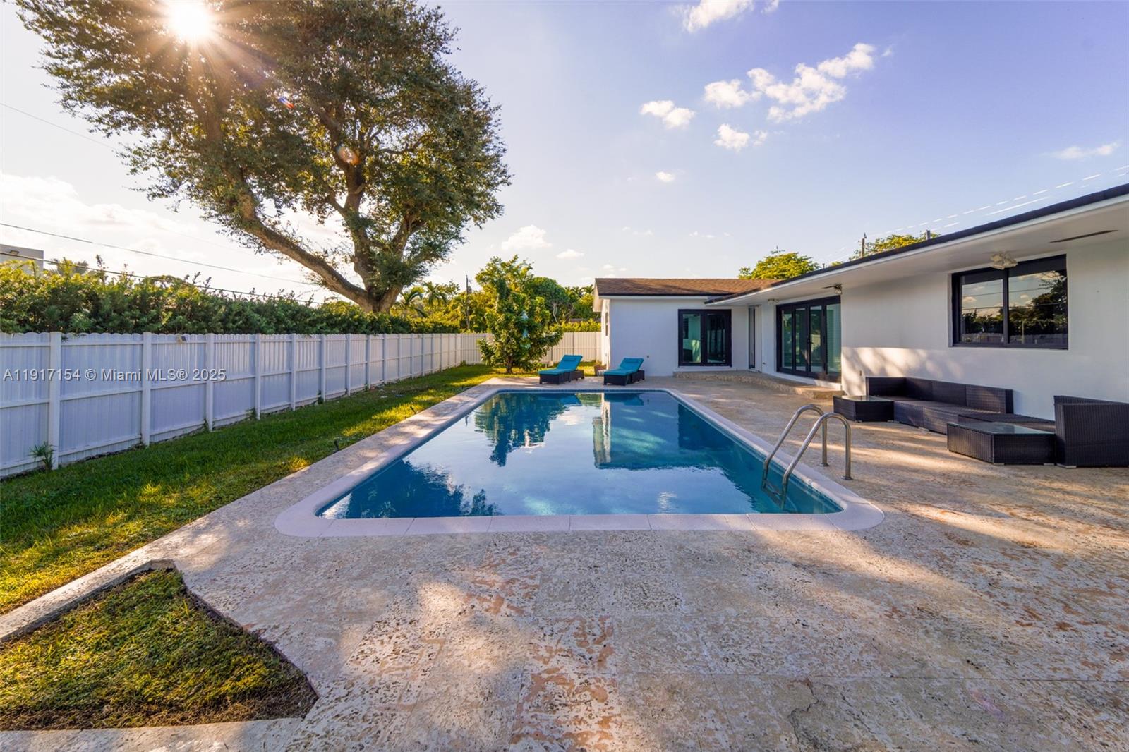 1850 Northeast 199th Street Miami, FL 33179 - Photo 21 of 29 a view of a house with backyard and sitting area