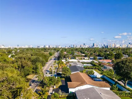 an aerial view of a house with yard