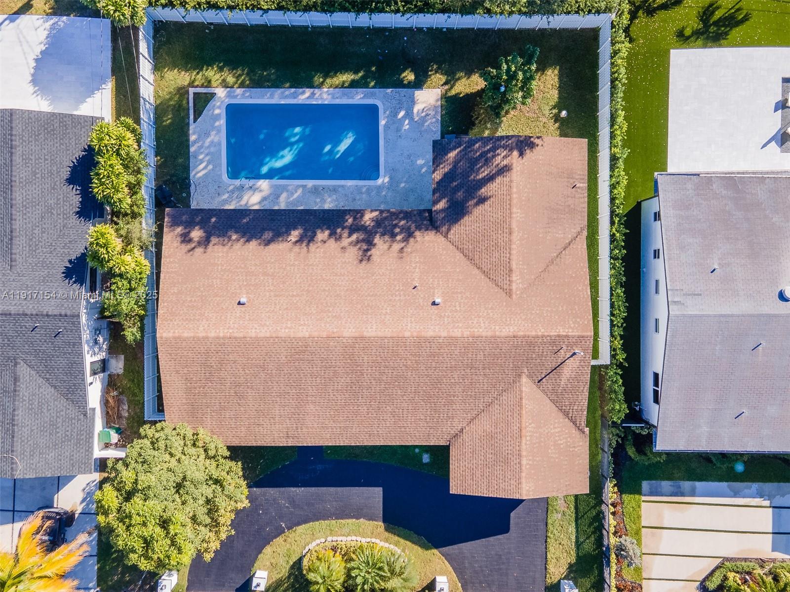 1850 Northeast 199th Street Miami, FL 33179 - Photo 27 of 29 an aerial view of a house with a swimming pool